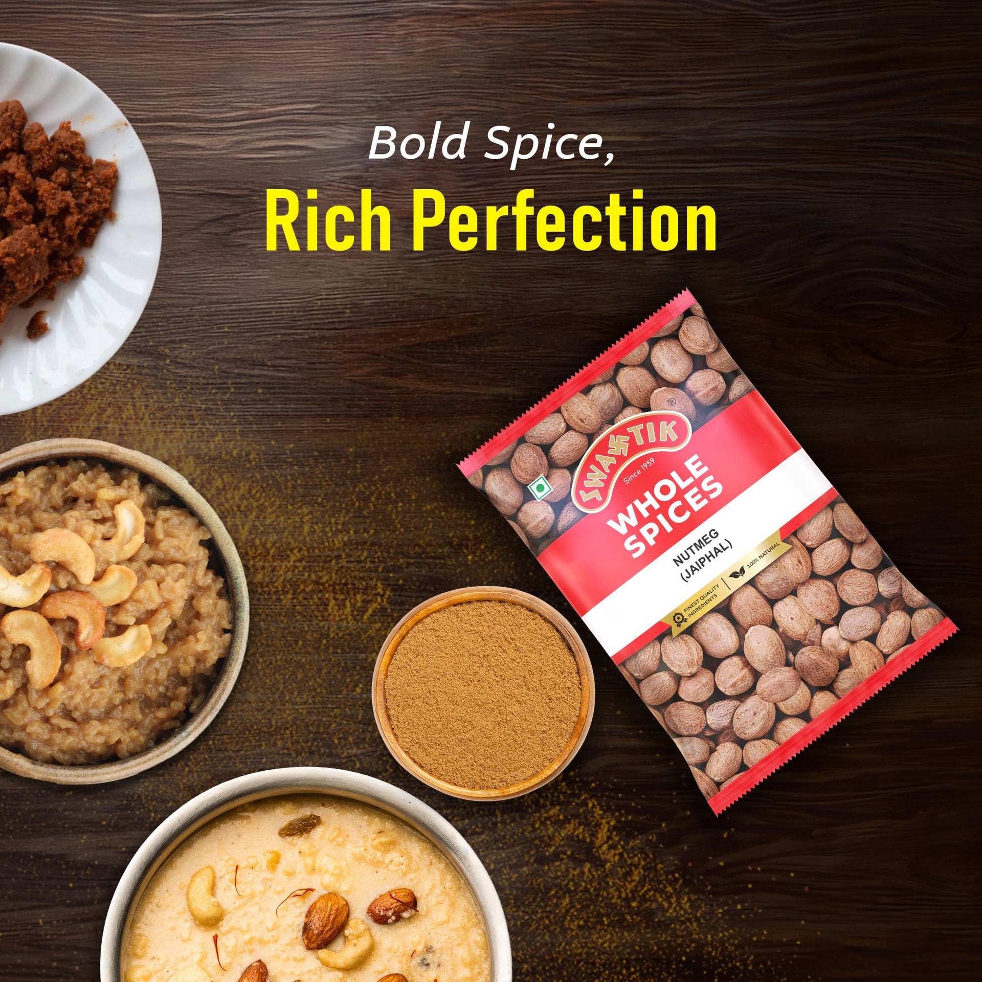 Swastik Nutmeg spice pack with Indian sweets on wooden background.