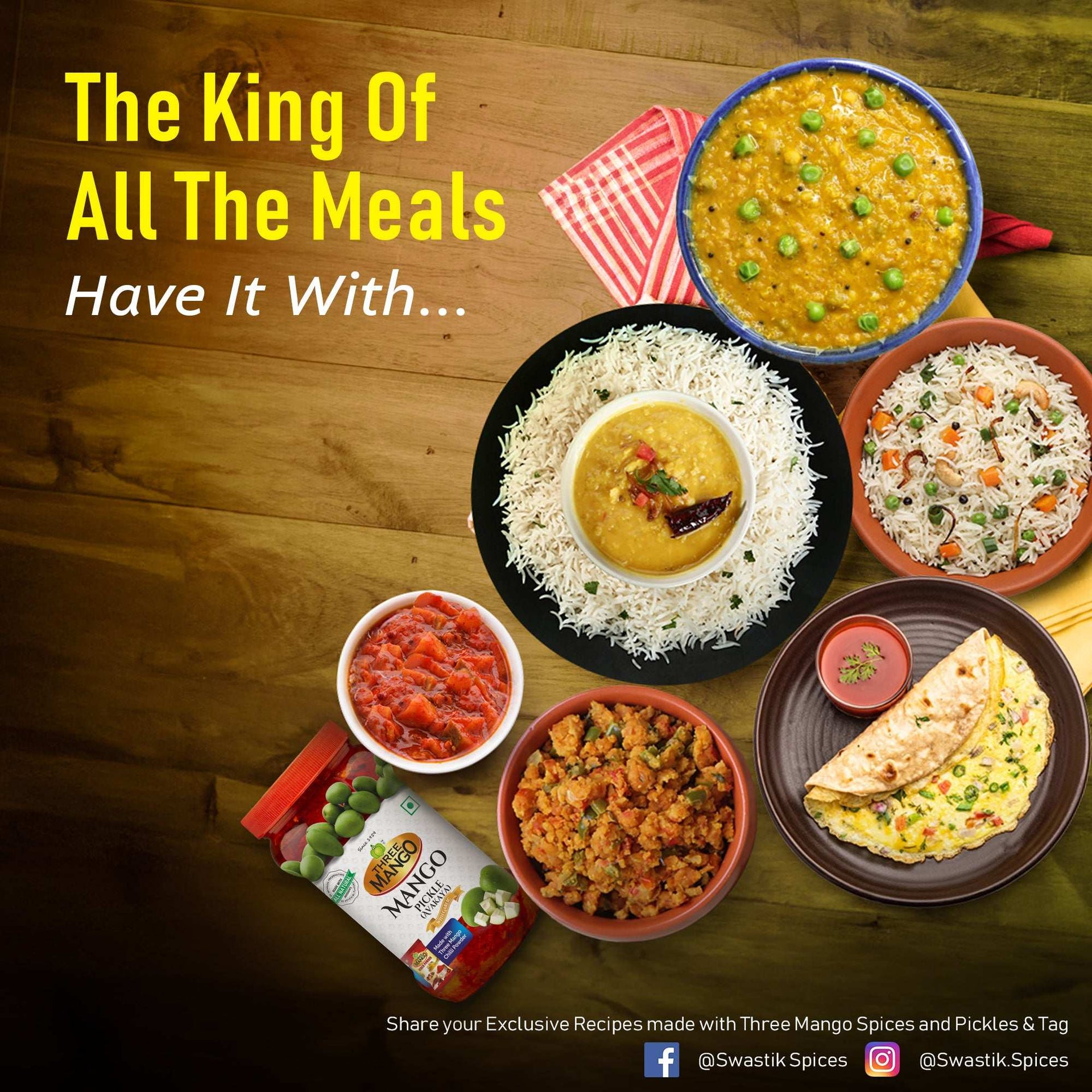 Delicious Three Mango mango pickle served with rice, dal, pulao, and Indian breads, showcasing a perfect meal pairing on a rustic wooden table.