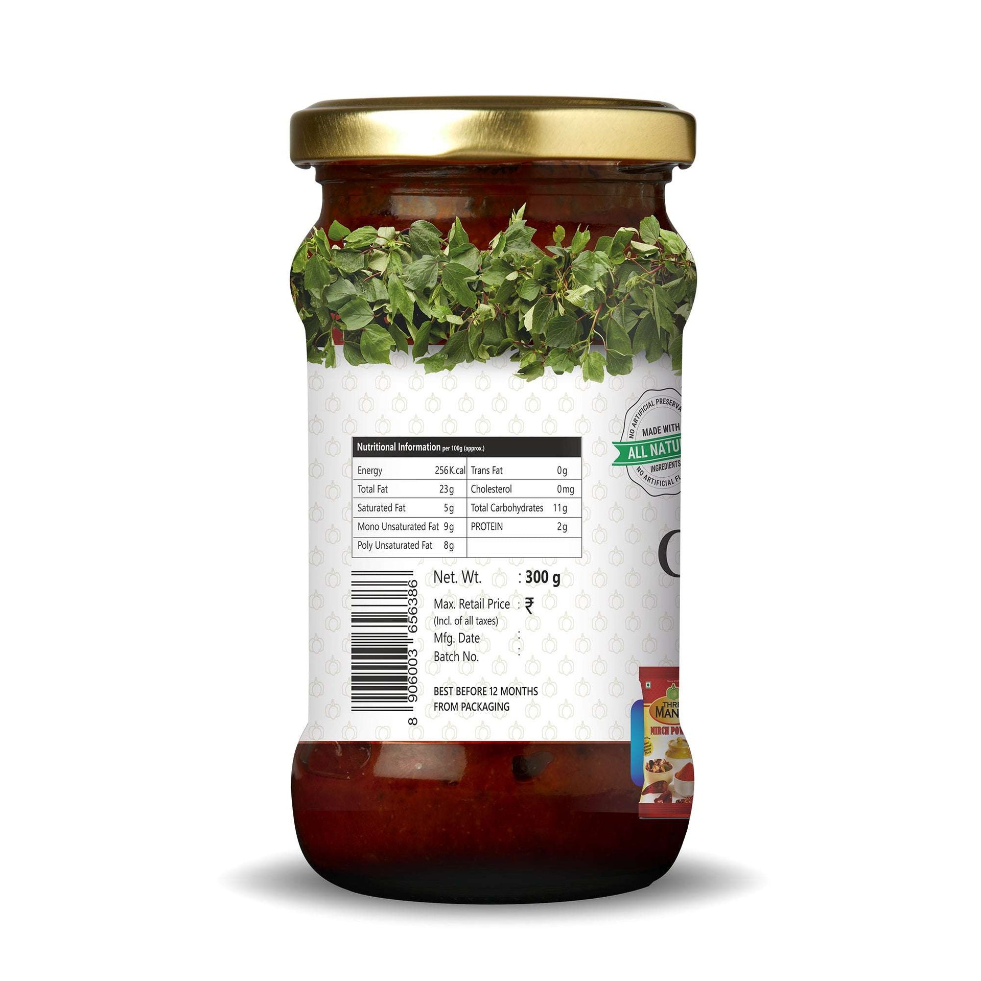Back view of Three Mango Gongura Pickle jar 300g showing nutrition facts, barcode, pricing, and expiry details on a white label with green gongura leaf design.