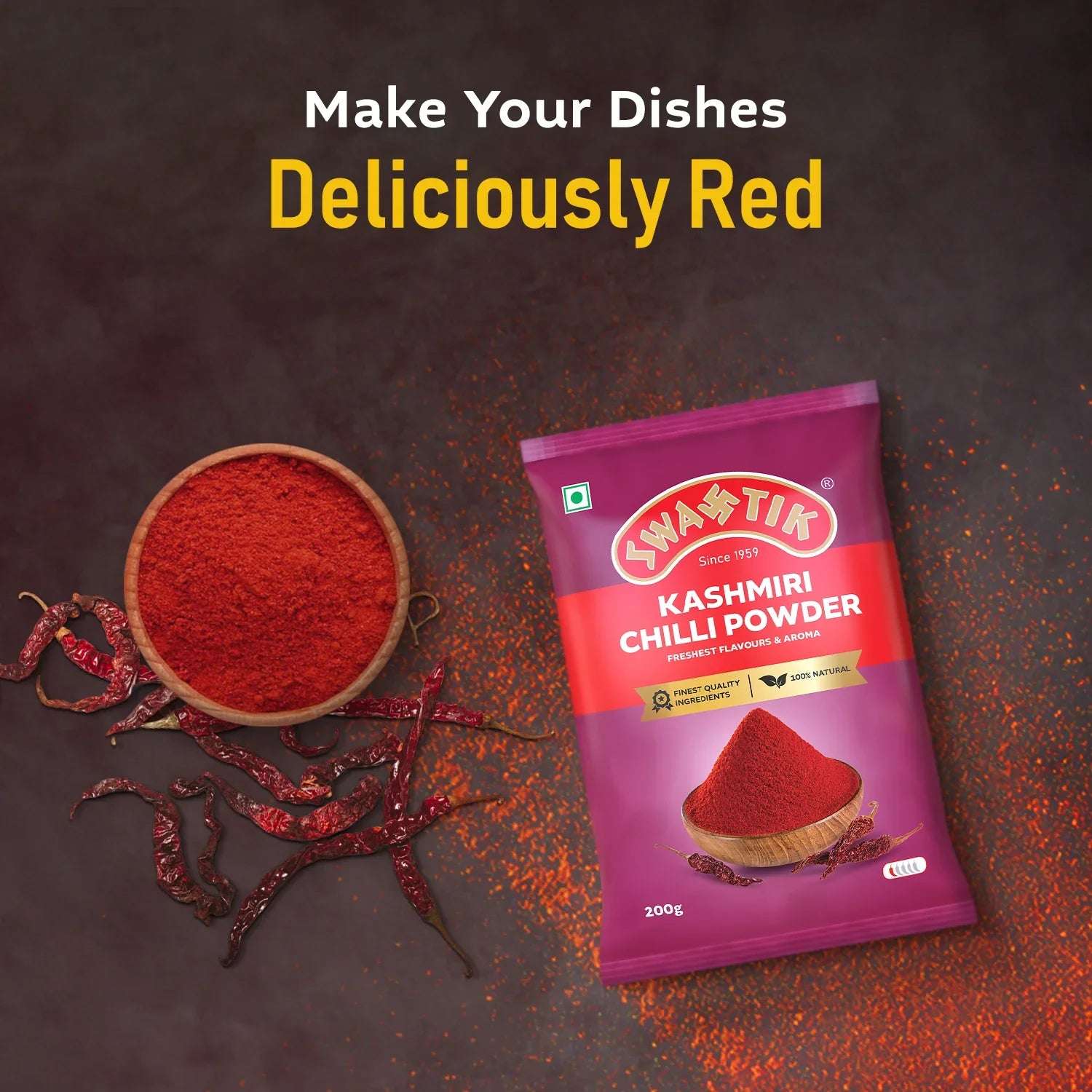 Swastik Kashmiri Chilli Powder 200g pouch flatlay with vibrant red chilli powder, whole Kashmiri chillies, and tagline "Make Your Dishes Deliciously Red"
