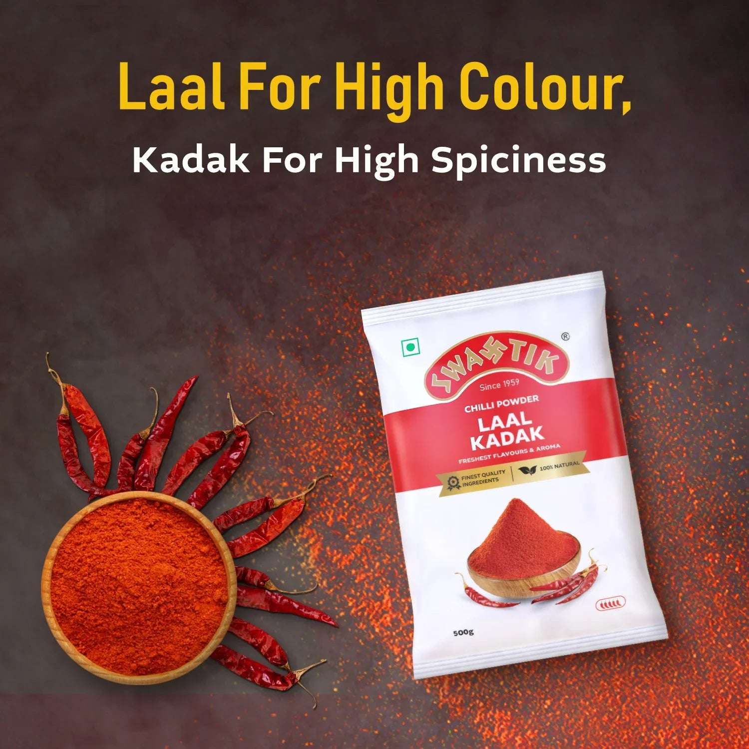 Swastik Laal Kadak Chilli Powder 500g pack placed beside a bowl of red chilli powder and whole chillies arranged like sun rays, with caption highlighting colour and spiciness.