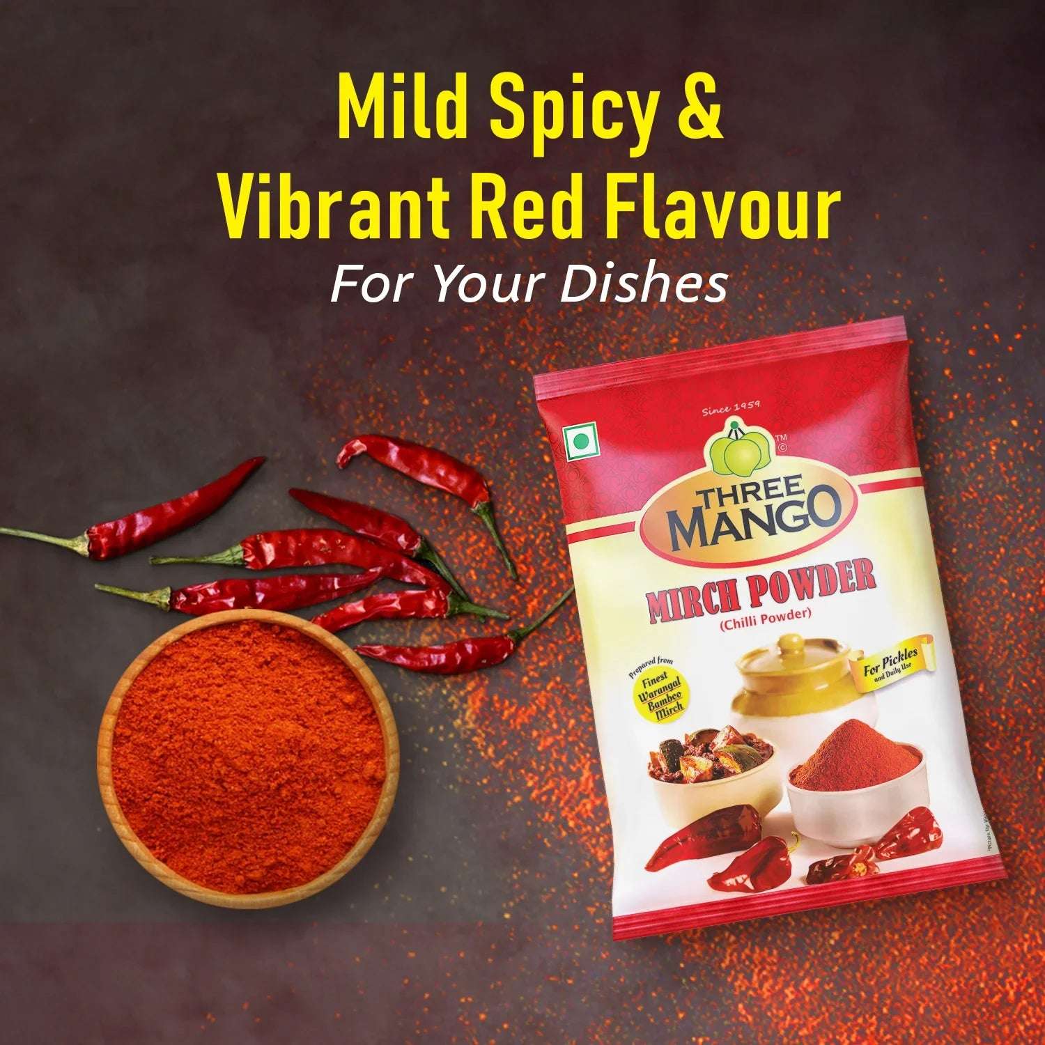 Three Mango Mirch Powder pack with dried red chillies and a bowl of chilli powder on a dark background, with the tagline 'Mild Spicy & Vibrant Red Flavour'